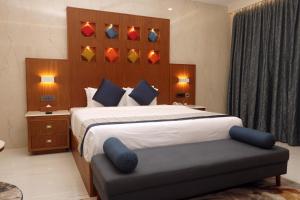 Postel nebo postele na pokoji v ubytování Vibe Munnar Resort & Spa