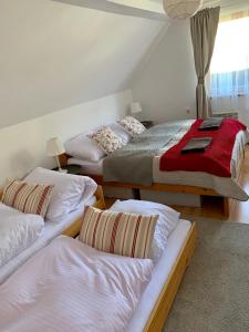 A bed or beds in a room at Chalupa Nad Lipou - Čičmany, turistika, sauna, krb