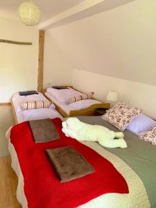 A bed or beds in a room at Chalupa Nad Lipou - Čičmany, turistika, sauna, krb