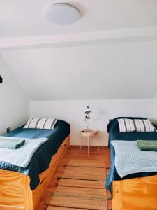 A bed or beds in a room at Chalupa Nad Lipou - Čičmany, turistika, sauna, krb