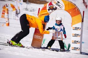 a woman and a child on skis in the snow at Zakopane - Króle 16 in Zakopane