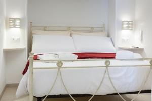 Letto o letti in una camera di Suite Dantè - Typical Apulian Rooms