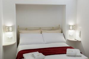 Letto o letti in una camera di Suite Dantè - Typical Apulian Rooms