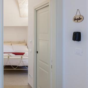 Postel nebo postele na pokoji v ubytování Suite Dantè - Typical Apulian Rooms