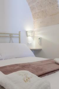 Letto o letti in una camera di Suite Dantè - Typical Apulian Rooms