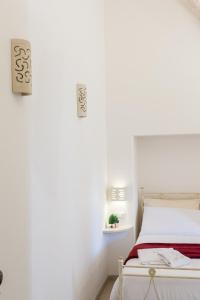 Postel nebo postele na pokoji v ubytování Suite Dantè - Typical Apulian Rooms