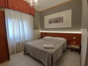 Кровать или кровати в номере Hotel Minerva