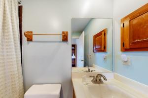 a bathroom with a tub and a sink and a mirror at Sugar Hill Delight in White River Junction +19 photos