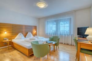 Postel nebo postele na pokoji v ubytování Hotel Cevedale