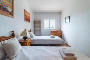 A bed or beds in a room at Flatguest Carvajal