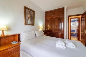 Rúm í herbergi á Flatguest Carvajal