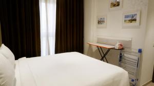 Postel nebo postele na pokoji v ubytování RELOhomes Serviced Apartment