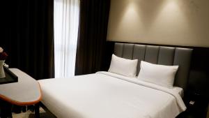 Postel nebo postele na pokoji v ubytování RELOhomes Serviced Apartment