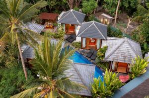 an aerial view of a resort with a swimming pool at Pradja Slumbung Villas in Nusa Penida