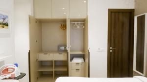 Postel nebo postele na pokoji v ubytování RELOhomes Serviced Apartment