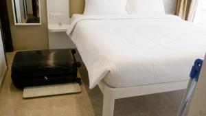Postel nebo postele na pokoji v ubytování RELOhomes Serviced Apartment