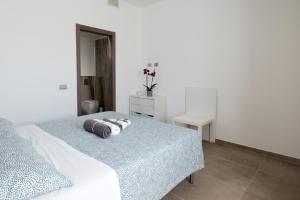 a bedroom with a bed with two pillows on it at Villino Liber in Milan