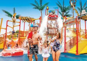 a family posing in front of a water park at Spacious 4 bedroom Geelong Home in Belmont