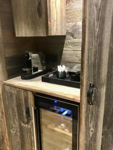 a kitchen with a stove and a counter top at Studio Megève centre in Megève