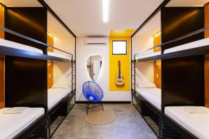 Ein Bett oder Betten in einem Zimmer der Unterkunft Ô de Casa Hostel