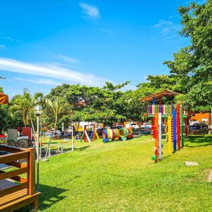 a park with a bunch of colorful playground equipment at Estada Inesquecível 17 Guarapari in Guarapari