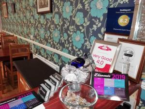 a wooden table with a desk with a table sidx sidx at Diamonds Guest House in York