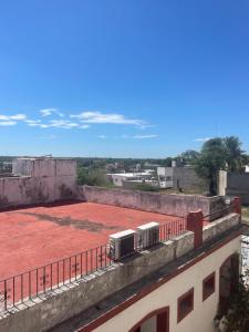 a train on top of a building with a red floor at Valentino in Termas de Río Hondo