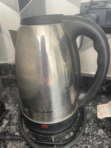 a tea kettle is sitting on a counter at Valentino in Termas de Río Hondo