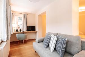 Televízia a/alebo spoločenská miestnosť v ubytovaní Hubertus Boutiquehotel Filzmoos