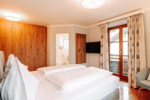 Posteľ alebo postele v izbe v ubytovaní Hubertus Boutiquehotel Filzmoos