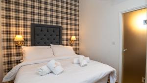 Posteľ alebo postele v izbe v ubytovaní Brettania Hotel