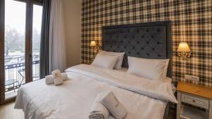 Posteľ alebo postele v izbe v ubytovaní Brettania Hotel