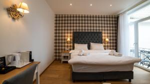 Posteľ alebo postele v izbe v ubytovaní Brettania Hotel