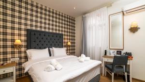 Posteľ alebo postele v izbe v ubytovaní Brettania Hotel