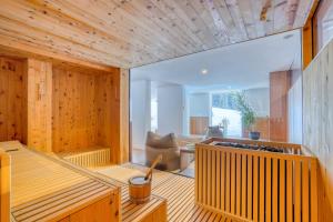 a room with a sauna with a chair in it at Hotel Cevedale in Solda