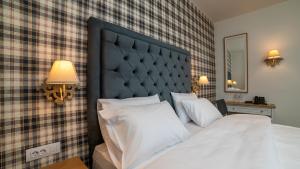 Posteľ alebo postele v izbe v ubytovaní Brettania Hotel