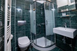 Kúpeľňa v ubytovaní Brettania Hotel