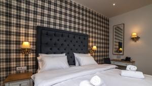 Posteľ alebo postele v izbe v ubytovaní Brettania Hotel