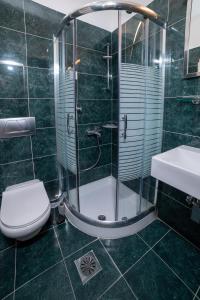 Kúpeľňa v ubytovaní Brettania Hotel