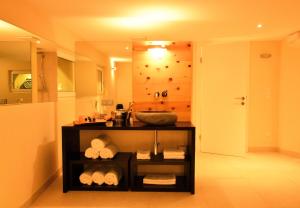 a bathroom with a sink and a counter with towels at Edelstein Apartments in Turracher Hohe +42 photos