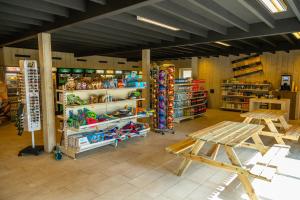 a store filled with lots of different types of toys at Comfort Rooms by EuroParcs Het Amsterdamse Bos in Amstelveen