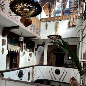 a building with mosaics and a staircase with a ceiling at Castle View Home stay in Jodhpur