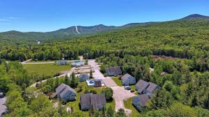 an aerial view of a home in the mountains at Killington Center Inn & Suites by Killington VR - 1 Bedrooms in Killington