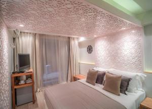 Postel nebo postele na pokoji v ubytování The Parlour Krabi