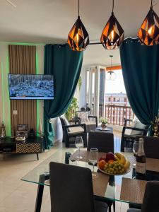a living room with a table with fruit on it at DREAMY SUNSET, SeaFront, Direct Access To The Promenade,Wifi,Free Parking in Los Cristianos