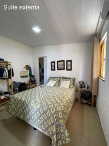 a bedroom with a bed in a room at Casa de Praia Ilhéus in Ilhéus