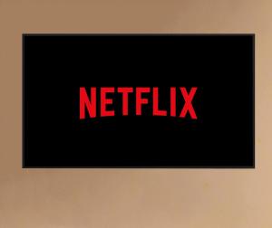 a picture of a netflix sign on a wall at PURA VIDA APARTMENT, Facing Lake Garda in Manerba del Garda