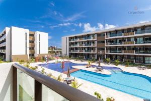 A piscina localizada em Mana Beach #C112 - Para 3 Pessoas por Carpediem ou nos arredores
