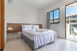 Cama ou camas em um quarto em Mana Beach #C112 - Para 3 Pessoas por Carpediem