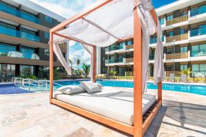 A piscina localizada em Mana Beach #C112 - Para 3 Pessoas por Carpediem ou nos arredores